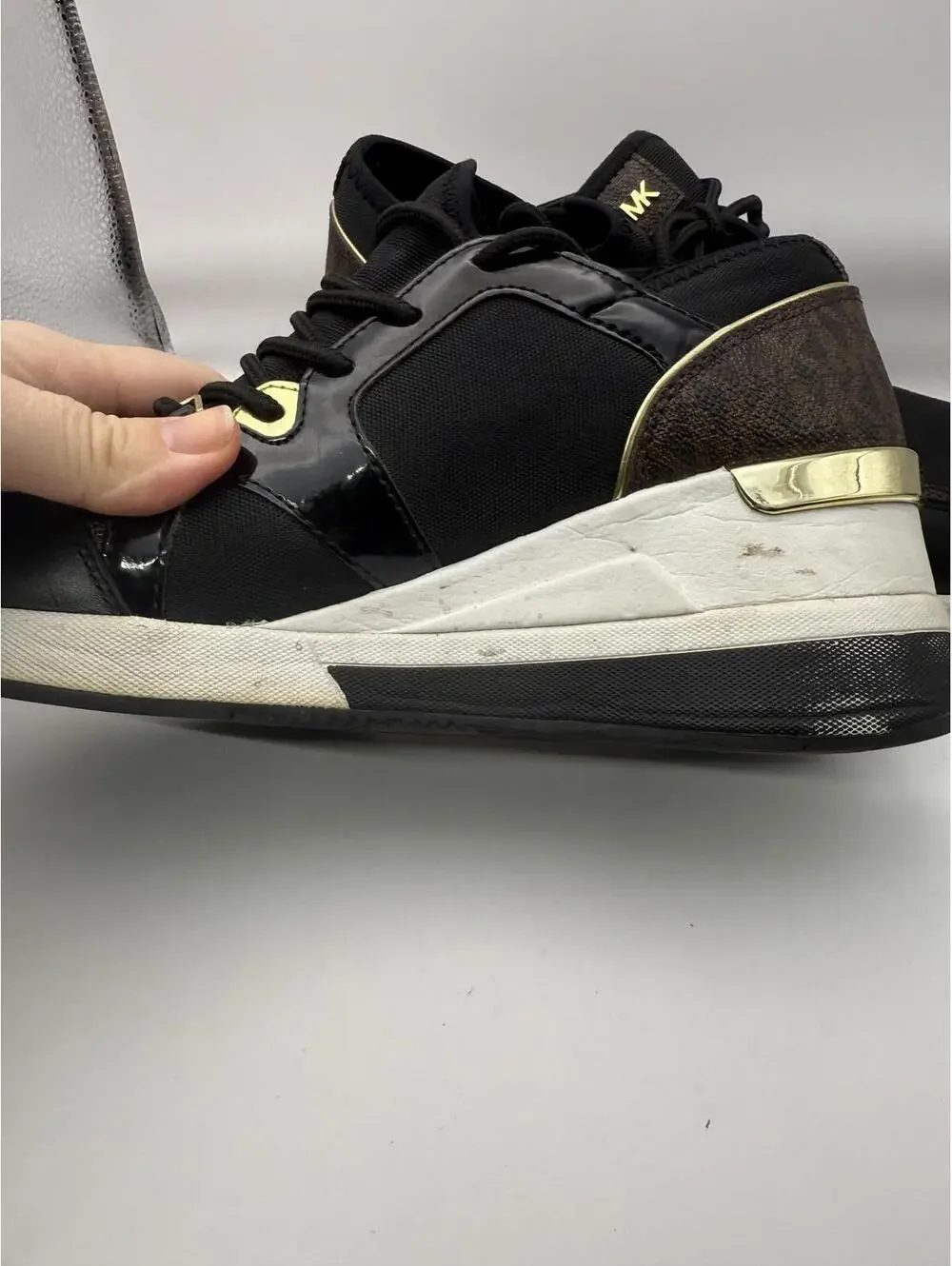 Michael Kors Women's Black and Gold Wedge Sneakers 8.5